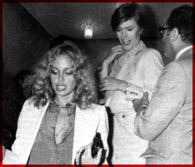 Paris, 24 June 1977.<br>David escorts Sydne Rome to the French premiere of TMWFTE.